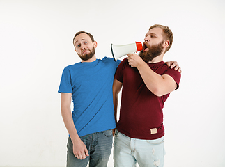 Image showing Young men weared in LGBT flag colors isolated on white background, LGBT pride concept