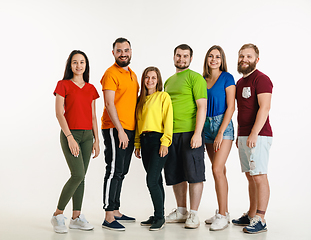 Image showing Young people weared in LGBT flag colors isolated on white background, LGBT pride concept