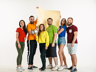 Image showing Young people weared in LGBT flag colors isolated on white background, LGBT pride concept