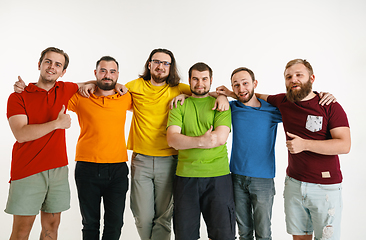 Image showing Young men weared in LGBT flag colors isolated on white background, LGBT pride concept