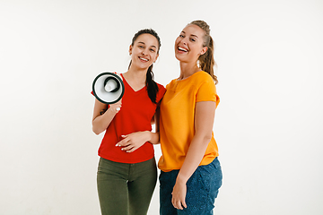 Image showing Young women weared in LGBT flag colors isolated on white background, LGBT pride concept