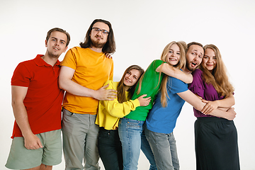 Image showing Young people weared in LGBT flag colors isolated on white background, LGBT pride concept