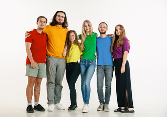 Image showing Young people weared in LGBT flag colors isolated on white background, LGBT pride concept