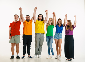 Image showing Young people weared in LGBT flag colors isolated on white background, LGBT pride concept