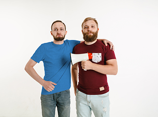 Image showing Young men weared in LGBT flag colors isolated on white background, LGBT pride concept