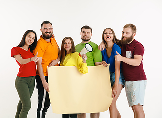 Image showing Young people weared in LGBT flag colors isolated on white background, LGBT pride concept