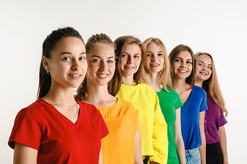 Image showing Young women weared in LGBT flag colors isolated on white background, LGBT pride concept