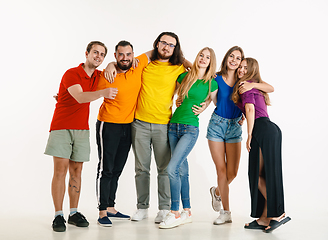 Image showing Young people weared in LGBT flag colors isolated on white background, LGBT pride concept