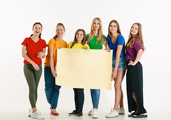 Image showing Young people weared in LGBT flag colors isolated on white background, LGBT pride concept