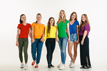 Image showing Young people weared in LGBT flag colors isolated on white background, LGBT pride concept