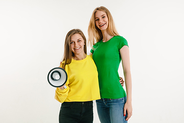 Image showing Young women weared in LGBT flag colors isolated on white background, LGBT pride concept