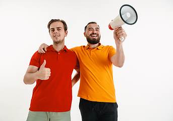 Image showing Young men weared in LGBT flag colors isolated on white background, LGBT pride concept