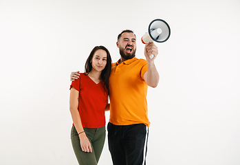 Image showing Young men weared in LGBT flag colors isolated on white background, LGBT pride concept