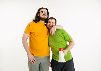 Image showing Young men weared in LGBT flag colors isolated on white background, LGBT pride concept