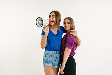 Image showing Young women weared in LGBT flag colors isolated on white background, LGBT pride concept