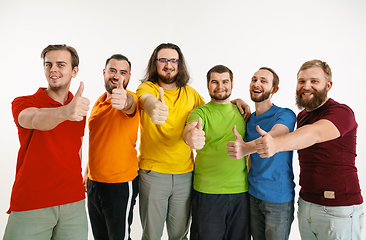 Image showing Young men weared in LGBT flag colors isolated on white background, LGBT pride concept