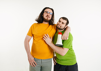 Image showing Young men weared in LGBT flag colors isolated on white background, LGBT pride concept