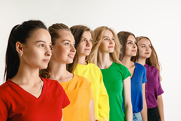 Image showing Young women weared in LGBT flag colors isolated on white background, LGBT pride concept