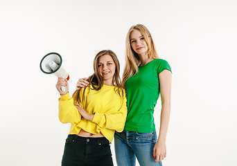 Image showing Young women weared in LGBT flag colors isolated on white background, LGBT pride concept