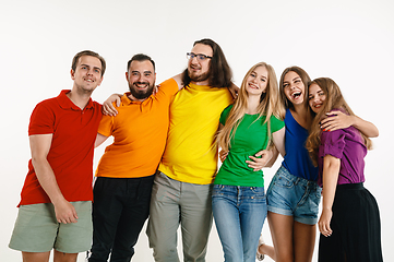 Image showing Young people weared in LGBT flag colors isolated on white background, LGBT pride concept