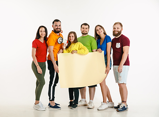 Image showing Young people weared in LGBT flag colors isolated on white background, LGBT pride concept