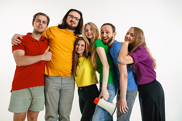 Image showing Young people weared in LGBT flag colors isolated on white background, LGBT pride concept