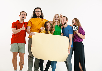 Image showing Young people weared in LGBT flag colors isolated on white background, LGBT pride concept