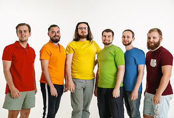 Image showing Young men weared in LGBT flag colors isolated on white background, LGBT pride concept