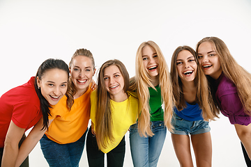 Image showing Young women weared in LGBT flag colors isolated on white background, LGBT pride concept