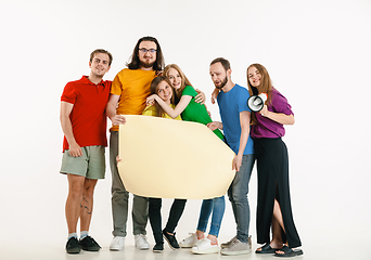 Image showing Young people weared in LGBT flag colors isolated on white background, LGBT pride concept