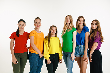 Image showing Young people weared in LGBT flag colors isolated on white background, LGBT pride concept