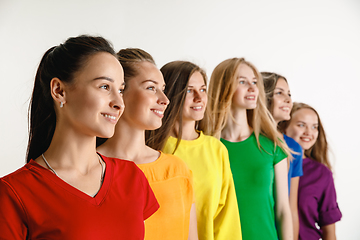 Image showing Young women weared in LGBT flag colors isolated on white background, LGBT pride concept