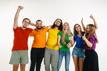 Image showing Young people weared in LGBT flag colors isolated on white background, LGBT pride concept