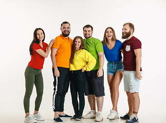 Image showing Young people weared in LGBT flag colors isolated on white background, LGBT pride concept