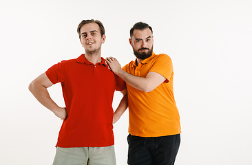 Image showing Young men weared in LGBT flag colors isolated on white background, LGBT pride concept