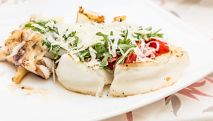 Image showing Cuttlefish with tomato, salad and Parmigiano cheese