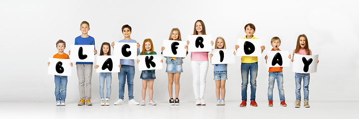 Image showing Black friday, sales concept - childrens with the tables and letters
