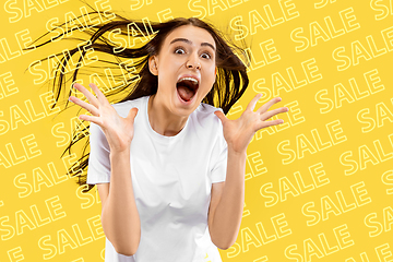 Image showing Portrait of young woman on yellow background, black friday