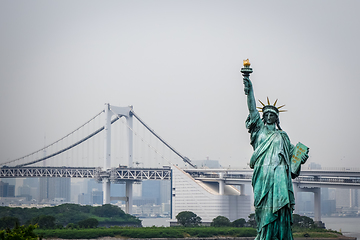 Image showing Statue of liberty and tokyo cityscape, Japan