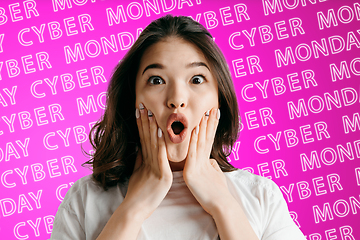 Image showing Portrait of young woman on pink background, black friday