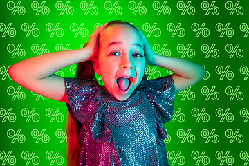 Image showing Portrait of little girl on green background, black friday