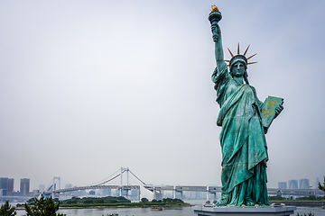 Image showing Statue of liberty and tokyo cityscape, Japan