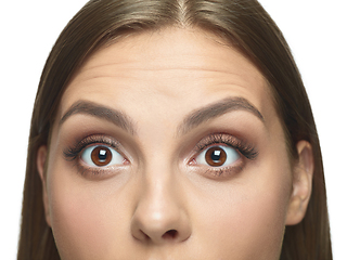 Image showing Close up portrait of beautiful young woman face on white studio background