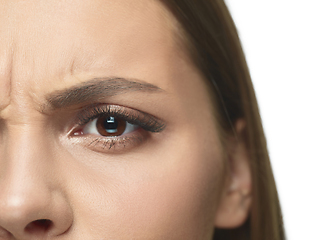 Image showing Close up portrait of beautiful young woman face on white studio background