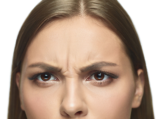 Image showing Close up portrait of beautiful young woman face on white studio background