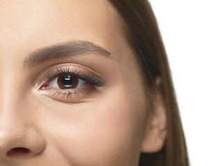 Image showing Close up portrait of beautiful young woman face on white studio background