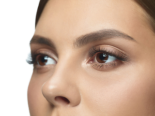 Image showing Close up portrait of beautiful young woman face on white studio background