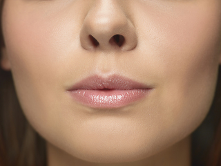 Image showing Close up portrait of beautiful young woman face on white studio background