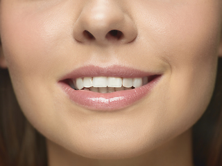 Image showing Close up portrait of beautiful young woman face on white studio background