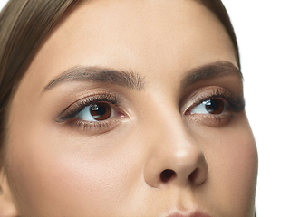 Image showing Close up portrait of beautiful young woman face on white studio background